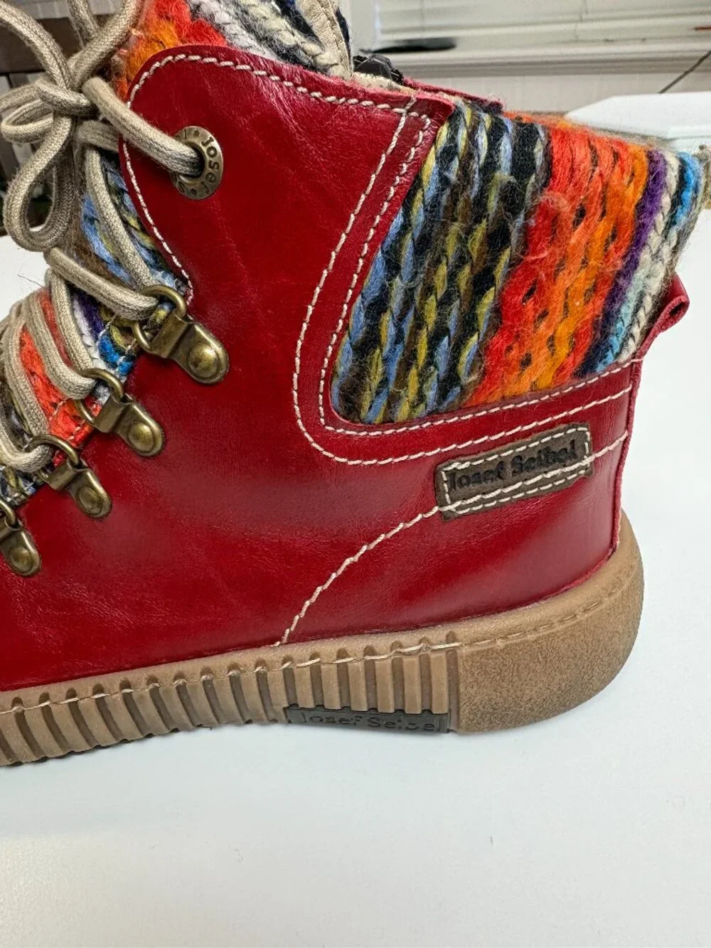 Josef Seibel Maren 06 leather ankle goots in red finish and colorful knit cuff.